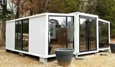 Instalar rápida Prefabricante Modular portátil plegable Packing plano de 2 dormitorios Casa de recipiente expandible con baño