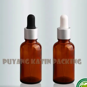 Botella de vidrio tubular transparente y ámbar con goteros