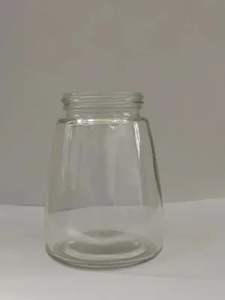 Botella de vidrio de forma moldeada atornillada para paquete de miel