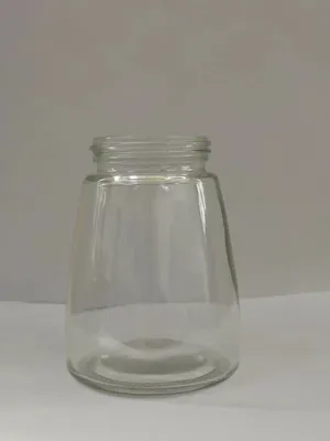 Botella de vidrio de forma moldeada atornillada para paquete de miel